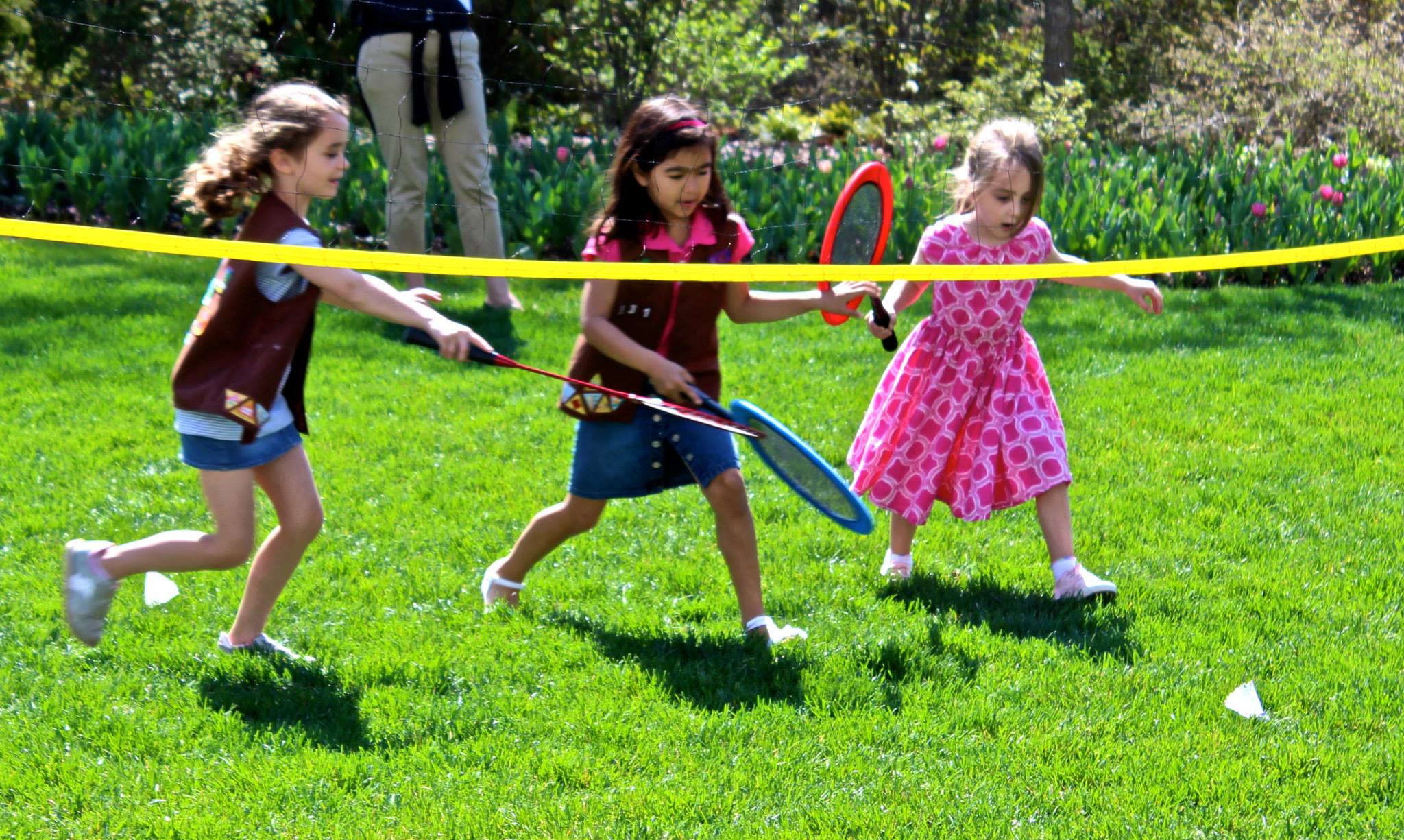 Girl Scouts playing badminton