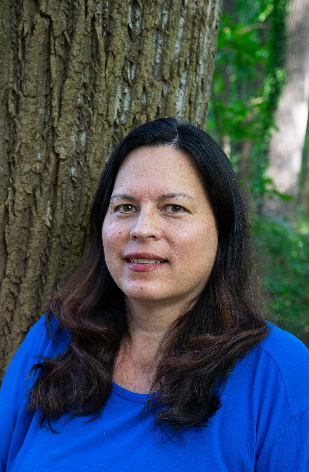 Ana Ka'ahanui headshot with tree behind