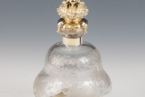 SMALL GLASS BOTTLE WITH STOPPER FROM A DRESSING TABLE SET (ONE OF TWO)
