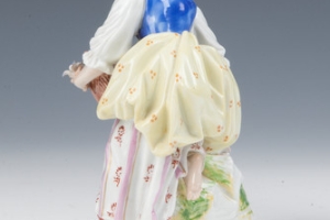 STATUETTE OF A WOMAN, ONE OF TWO