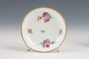COVERED CUP AND SAUCER FROM CHEST