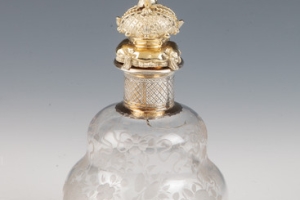 SMALL GLASS BOTTLE WITH STOPPER FROM A DRESSING TABLE SET (ONE OF TWO)
