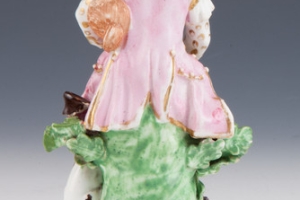 FIGURINE OF A MUSICIAN, ONE OF TWO