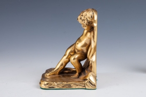 BOOKEND IN THE FORM OF CUPID, ONE OF TWO