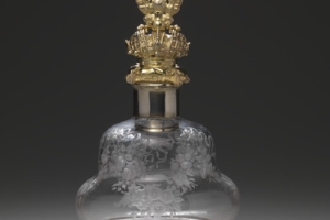 LARGE GLASS BOTTLE WITH STOPPER FROM A DRESSING TABLE SET (ONE OF TWO)