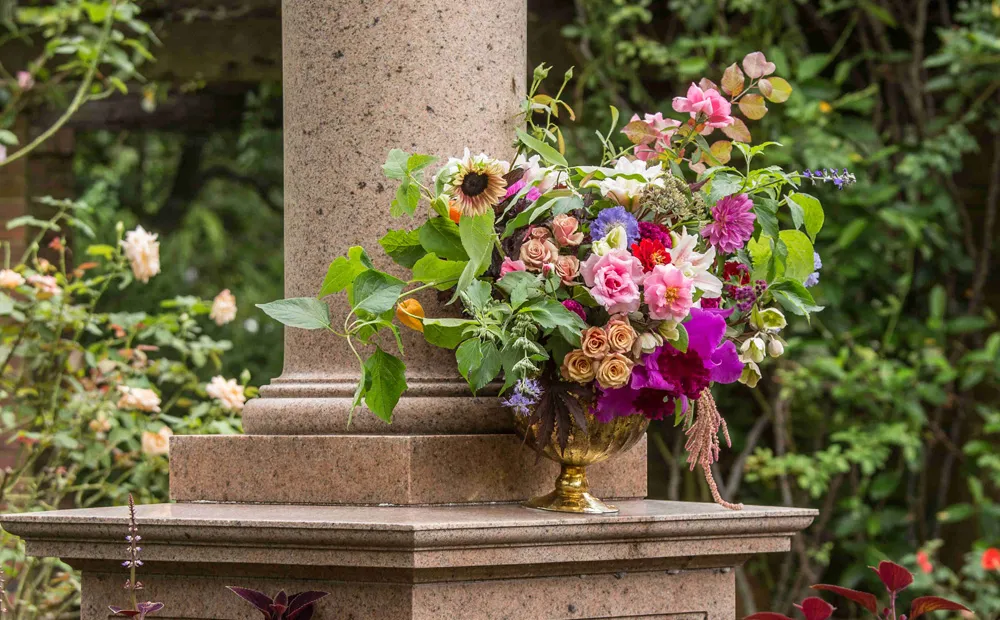 Flowers on the monument for Marjorie Merriweather Post